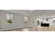 Open concept kitchen and living area with island, hardwood floors, and modern appliances at 2018 Quiet Ibis Rd, Hanahan, SC 29410