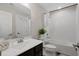 Clean bathroom with a tub shower combo and dark vanity at 440 Coopers Hawk Dr, Summerville, SC 29483