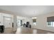 Open concept dining area with hardwood floors and chandelier at 440 Coopers Hawk Dr, Summerville, SC 29483