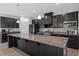 Modern kitchen with dark cabinets and granite countertops at 440 Coopers Hawk Dr, Summerville, SC 29483