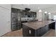Modern kitchen with dark cabinets and granite countertops at 440 Coopers Hawk Dr, Summerville, SC 29483