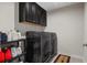 Laundry room with washer, dryer, and storage cabinets at 440 Coopers Hawk Dr, Summerville, SC 29483
