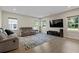 Spacious living room with hardwood floors and large TV at 440 Coopers Hawk Dr, Summerville, SC 29483