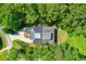 Bird's-eye view of a house nestled in a lush green forest setting at 4858 Marshwood Dr, Hollywood, SC 29449