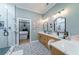 Elegant bathroom with double vanity, frameless shower, and patterned floor tiles at 4858 Marshwood Dr, Hollywood, SC 29449