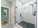 Modern bathroom with a walk-in shower, pebble floor, and subway tile walls at 4858 Marshwood Dr, Hollywood, SC 29449