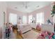 Bright and airy bedroom featuring a floral wall accent and playful furnishings at 4858 Marshwood Dr, Hollywood, SC 29449