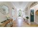 Elegant entryway with hardwood floors, decorative mirrors, and a bench at 4858 Marshwood Dr, Hollywood, SC 29449