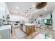 Modern kitchen with white cabinets, a large island, and quartz countertops at 4858 Marshwood Dr, Hollywood, SC 29449