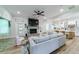 Open living space with a cozy sectional sofa and a brick fireplace at 4858 Marshwood Dr, Hollywood, SC 29449