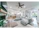 Spacious living room featuring an L-shaped sofa and open kitchen views at 4858 Marshwood Dr, Hollywood, SC 29449