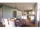Well-lit dining area with a wooden table and white chairs at 524 Hayes Park Blvd # 3, Johns Island, SC 29455