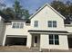 Charming two-story home boasts a bright white exterior, a spacious garage, and modern black roof at 524 Hayes Park Blvd # 3, Johns Island, SC 29455