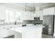 Modern kitchen with white cabinets, large island, and stainless steel appliances at 524 Hayes Park Blvd # 3, Johns Island, SC 29455