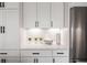 White kitchen with stainless steel appliances and white shaker cabinets at 524 Hayes Park Blvd # 3, Johns Island, SC 29455