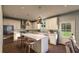 Modern kitchen with island, stainless steel appliances, and white cabinets at 524 Hayes Park Blvd # 3, Johns Island, SC 29455