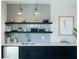 Modern wet bar with floating shelves, stylish backsplash, and sleek cabinetry at 524 Hayes Park Blvd # 3, Johns Island, SC 29455