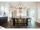 Open concept dining area with a large table and chandelier at 528 Hayes Park Blvd # 4, Johns Island, SC 29455