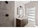 Modern bathroom with double vanity, large mirror and walk-in shower at 5344 Sea Watch Lane, North Charleston, SC 29406