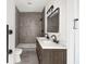 Modern bathroom with double vanity, large mirror and walk-in shower at 5344 Sea Watch Lane, North Charleston, SC 29406