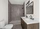 Modern bathroom with double vanity, large mirror and walk-in shower at 5344 Sea Watch Lane, North Charleston, SC 29406