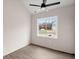 Simple bedroom with wood-look floors and a window at 5344 Sea Watch Lane, North Charleston, SC 29406
