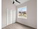 Bright bedroom featuring wood-look floors and a window at 5344 Sea Watch Lane, North Charleston, SC 29406