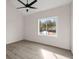 Well-lit bedroom with wood-look floors and a window at 5344 Sea Watch Lane, North Charleston, SC 29406