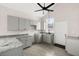 Modern kitchen featuring gray cabinets, granite countertops, and tile flooring at 5344 Sea Watch Lane, North Charleston, SC 29406