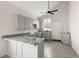 Modern kitchen featuring gray cabinets, granite countertops, and a breakfast bar at 5344 Sea Watch Lane, North Charleston, SC 29406
