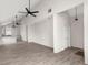 Spacious living area with high ceilings, gray flooring, and ceiling fans at 5344 Sea Watch Lane, North Charleston, SC 29406