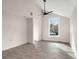 Bright living room with large windows, hardwood floors, and a ceiling fan at 5344 Sea Watch Lane, North Charleston, SC 29406