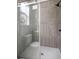 Modern shower with gray tile and glass enclosure at 5344 Sea Watch Lane, North Charleston, SC 29406