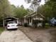 One-story house with carport and a white car at 571 Main Rd, Johns Island, SC 29455