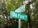 Green street signs marking the intersection of Old Pond Rd and Main Rd at 571 Main Rd, Johns Island, SC 29455
