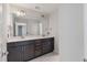 Double vanity bathroom with dark cabinets and quartz countertops at 602 Yellow Leaf Ln, Summerville, SC 29486