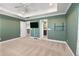 Bright bedroom with green walls, carpeting, and ensuite bathroom at 602 Yellow Leaf Ln, Summerville, SC 29486