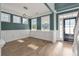 Dining room with hardwood floors, teal walls, and wainscoting at 602 Yellow Leaf Ln, Summerville, SC 29486