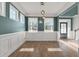 Bright dining room with hardwood floors, wainscoting, and pendant lights at 602 Yellow Leaf Ln, Summerville, SC 29486