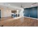 Open living room with hardwood floors and access to kitchen at 602 Yellow Leaf Ln, Summerville, SC 29486