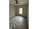 Bedroom with neutral gray walls, plush carpeting and a ceiling fan at 6209 Drayton St, Ravenel, SC 29470