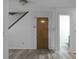 Basement with wood door and access to another bathroom at 6240 April Pine Cir # B, North Charleston, SC 29406