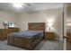 Spacious bedroom with a wooden bed frame, dresser, and TV at 6240 April Pine Cir # B, North Charleston, SC 29406