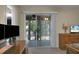 Bedroom with sliding glass doors leading to a screened porch at 6240 April Pine Cir # B, North Charleston, SC 29406