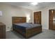 Second bedroom with wooden double doors and ceiling fan at 6240 April Pine Cir # B, North Charleston, SC 29406