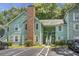 Inviting light green two-story building with brick chimney and parking at 6240 April Pine Cir # B, North Charleston, SC 29406