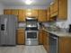 Efficient kitchen with stainless steel appliances and wood cabinets at 6240 April Pine Cir # B, North Charleston, SC 29406