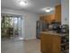 Open concept kitchen with breakfast bar and view of patio at 6240 April Pine Cir # B, North Charleston, SC 29406