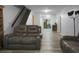 Living room with gray leather recliners and wood flooring at 6240 April Pine Cir # B, North Charleston, SC 29406