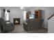 Living room with fireplace, two recliners, and wood shelving at 6240 April Pine Cir # B, North Charleston, SC 29406